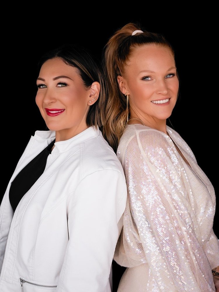 Ashlee and Erin standing back to back
